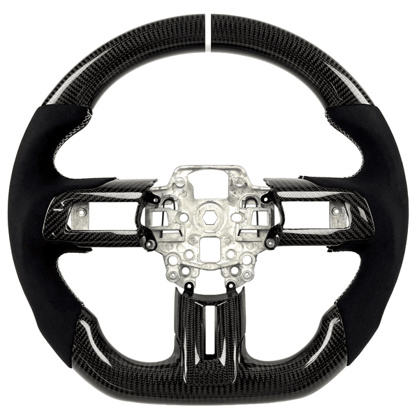 2015–2023 Ford Mustang S550 carbon fiber steering wheel by Texas Carbon with gloss woven carbon fiber, black Alcantara grips, white stitching, a white center stripe, and a flat-bottom design.