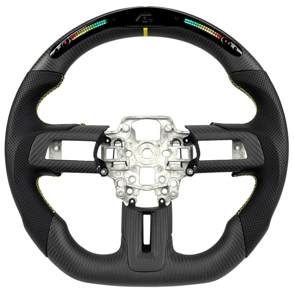 2015–2023 Ford Mustang S550 carbon fiber LED steering wheel by Texas Carbon with RPM shift lights, a flat-bottom rim, black perforated leather grips, yellow stitching, and a yellow center stripe.