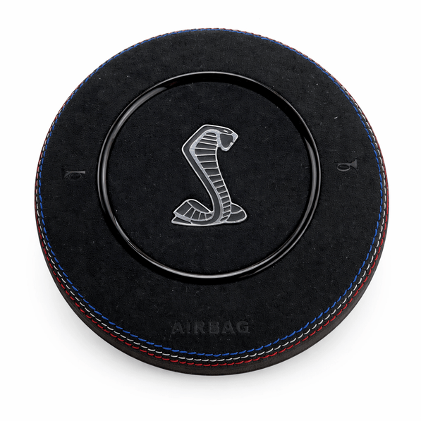 2015-2023 Ford Mustang S550 custom black Alcantara airbag cover with Shelby Cobra emblem, red-and-blue stitching, and gloss black trim ring
