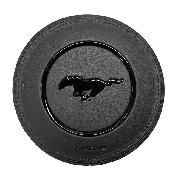 Texas Carbon custom black leather steering wheel airbag cover for 2015–2023 Ford Mustang S550 with black stitching, gloss black trim ring, and gloss black pony emblem.