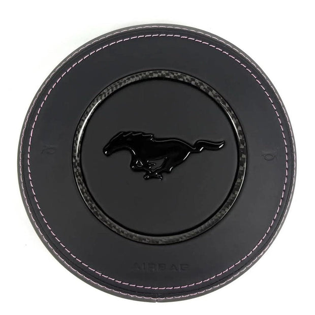 2015-2023 Ford Mustang S550 custom black leather airbag cover with pink stitching, carbon fiber trim ring, and gloss black pony emblem