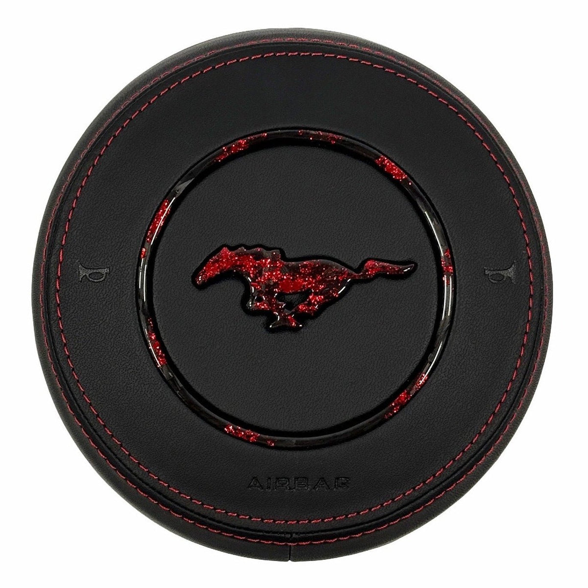 Custom black leather airbag cover for 2015–2023 Ford Mustang S550 with red stitching, red-flake forged carbon fiber pony emblem, and matching forged carbon trim ring.