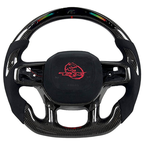 Ram 1500 TRX carbon fiber LED custom steering wheel with black Alcantara grips, paddle shifters, and red embroidered airbag cover